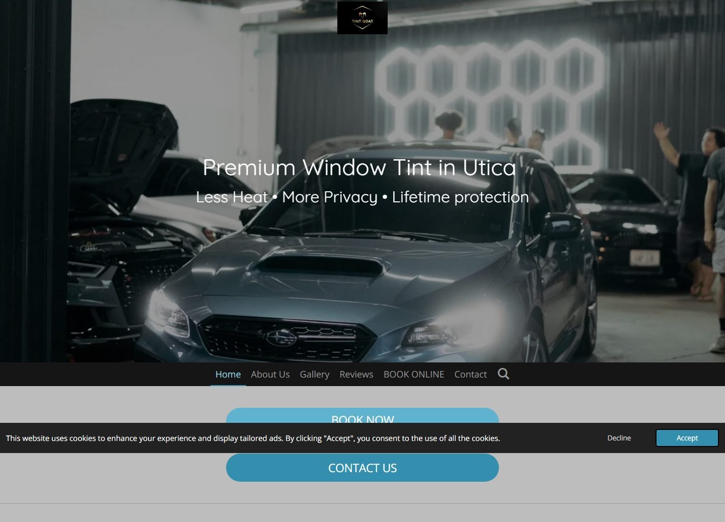 The original TintGoat homepage — navigation sitting below the hero photo, no phone number, a cookie banner across the buttons