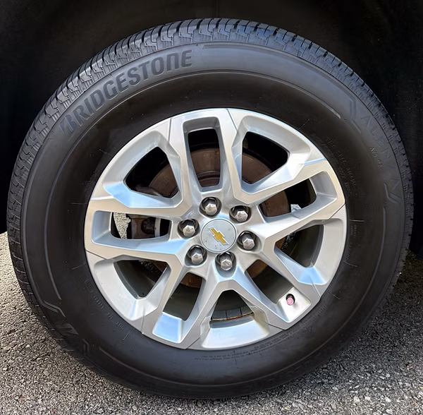 Alloy wheel, brake caliper and tire cleaned to the barrel during a detail in Rochester, NY